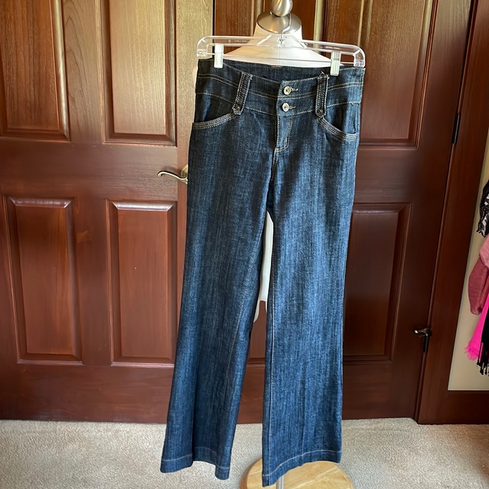 Flared jeans from Maurices size 3/4. Dark denim with back pockets.